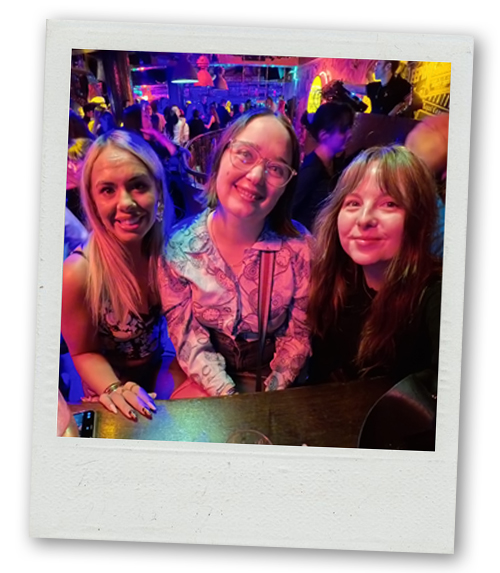 Billie, Hannah and Rebekah sat at a party bar on the Dublin Guided Bar Crawl