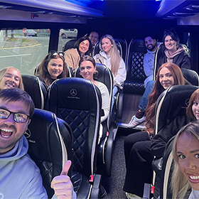  Team LNOF sat on a mini bus 