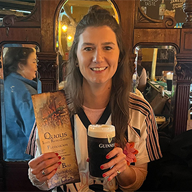  Frankie posing with a menu and a Guinness 