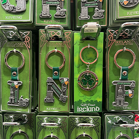  Four Irish keyrings arranged to read LNOF with a Shamrock for an O 