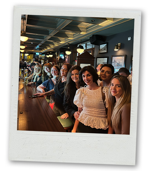 Team stood by the bar at Porter's bar in Dublin