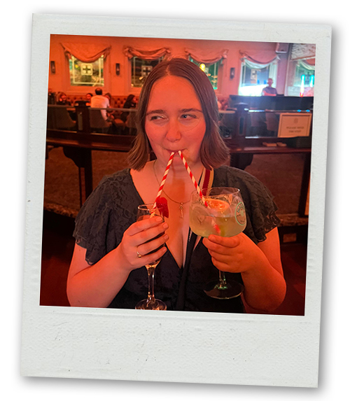 Hannah, LNOF's content writer, drinking a prosecco and a double gin at the same time with two straws