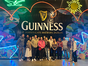 Team LNOF posing in front of a wall that reads Guinness, St James's Gate Brewery, Dublin 
