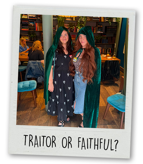 Shauna and Chrisite wearing green traitors cloacks with the caption Traitor or Faithful