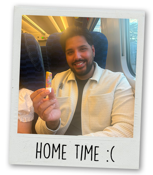 Akash on a train with the caption Home Time :(