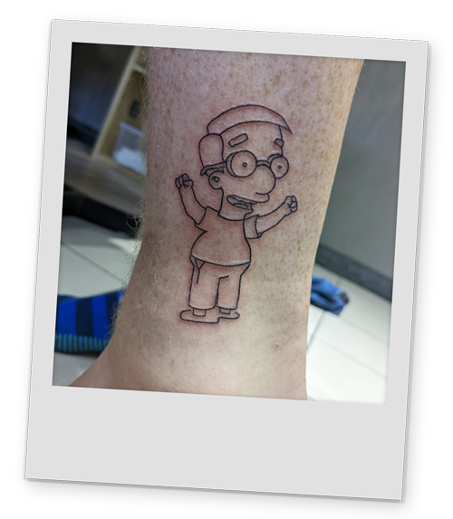 A polaroid style image of one of Team LNOF's tattoo of Milhouse from the Simpsons they got in Krakow
