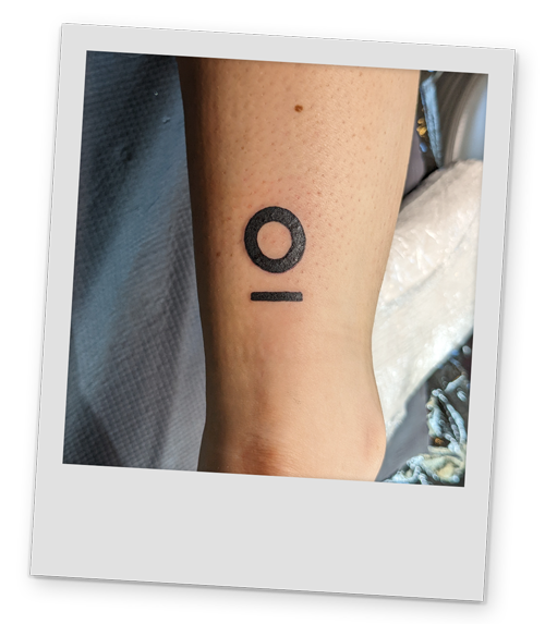 A polaroid style image of one of Team LNOF's tattoo of the company logo they got in Krakow