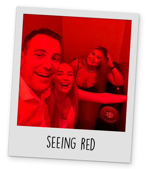 A polaroid style image of some of Team LNOF in a club with red lighting in Krakow, with text reading 'Seeing Red' at the bottom