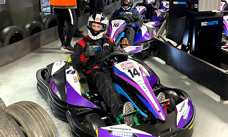 A man in a go kart giving a thumbs up to the camera at Teamsport Newcastle