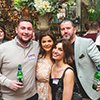  Four members of our sales staff, two male and two female, posing for a picture holding beers. 