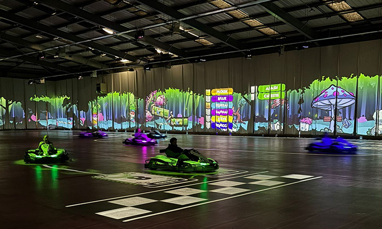 Team LNOF karting around BattleKart which has animated walls