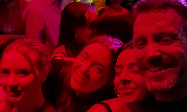 Akash wearing a green Irish hat and a ginger wig