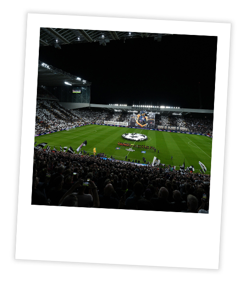 A Polaroid of a football match at St James’ Park at night