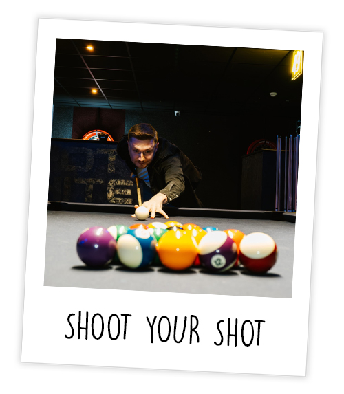 A Polaroid of a man who is playing pool with the caption Shoot Your Shot