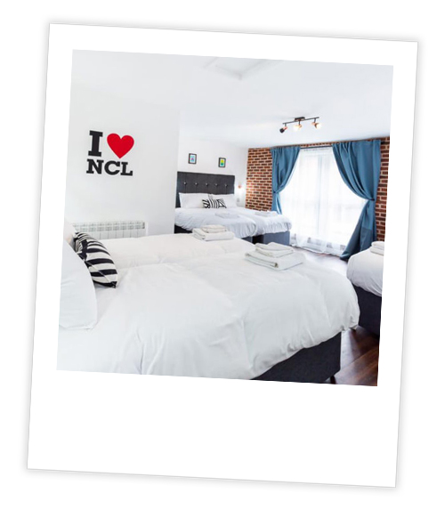 A Polaroid of the exterior of Swarley’s pub which has been captioned with Out On The Toon