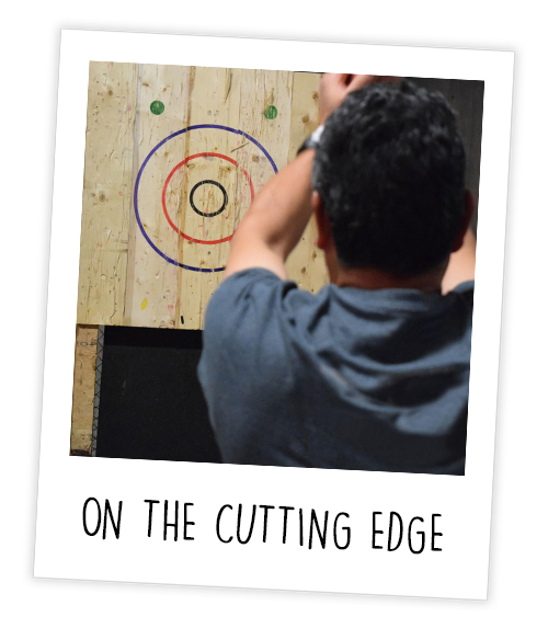 A Polaroid of a man doing Urban Axe Throwing with the caption On The Cutting Edge