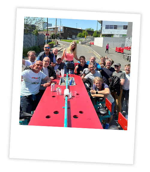 A Polaroid of a stag group posing with a beer bike