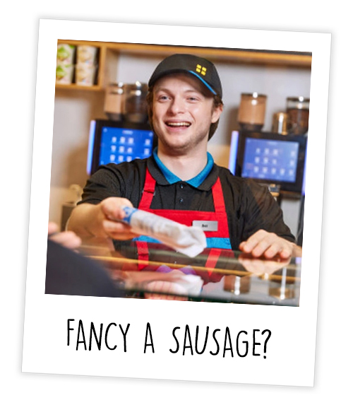A Polaroid of a man who works in Greggs serving a customer a sausage roll with the caption Fancy A Sausage?