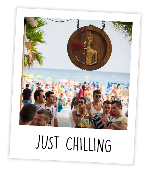 A Polaroid of a group of people at a beach club which is captioned Just Chilling