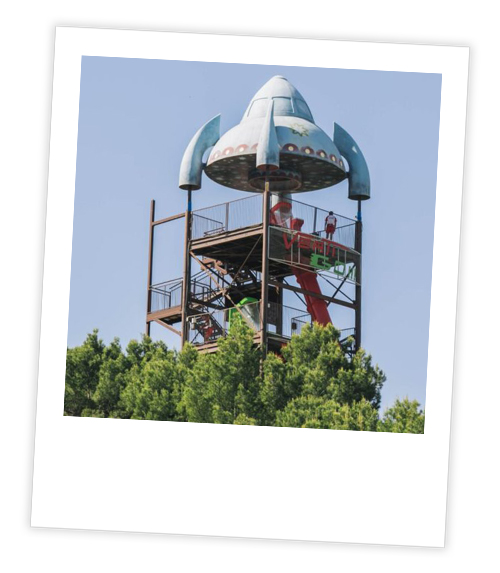 A Polaroid of a very tall water slide