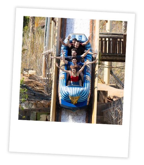 A Polaroid of 5 people in a log flume ride going down a drop