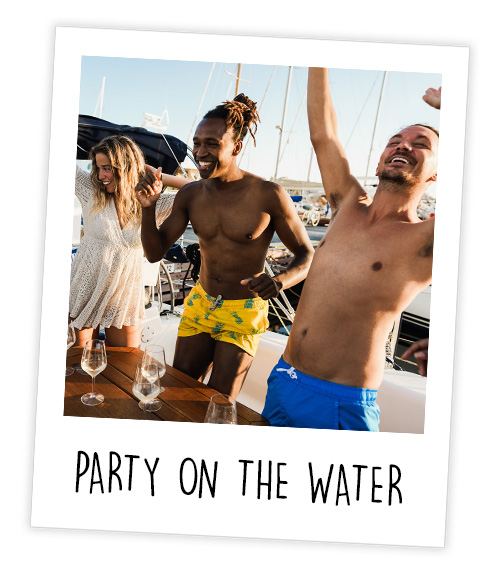 A Polaroid of two men and a woman who are stood on a boat with empty drinks glasses which is captioned Party On The Water