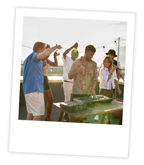 A Polaroid of a mixed gender group of people who are partying on a boat