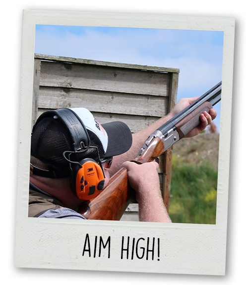 A Polaroid of a man aiming a clay pigeon shooting gun up into the sky