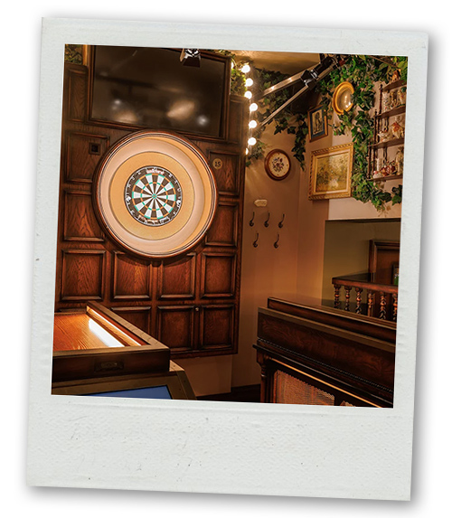 A Polaroid of Flight Club that has a darts board