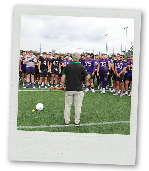 A Polaroid of a stag do group who are standing ready to play some Gaelic football
