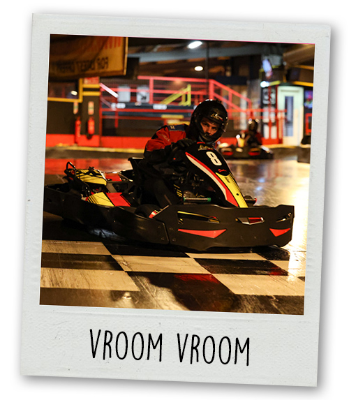 A Polaroid of a man go karting with the caption Vroom Vroom