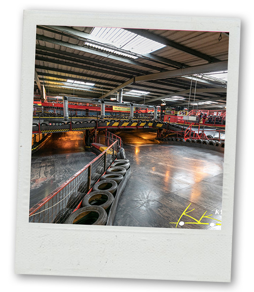 A Polaroid of a go karting track that has multiple levels