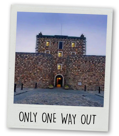 A Polaroid of the outside of the jail-themed escape room with the caption Only One Way Out