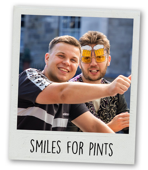 A Polaroid of a two men on a pedi bus with the caption Smiles for Pints