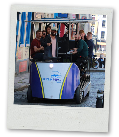 A Polaroid of a stag do on a pedi bus pedalling around Dublin