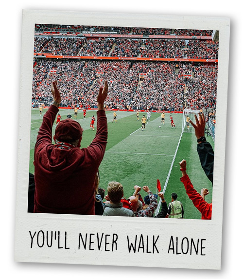A Polaroid of Anfield on a match day with the caption You'll Never Walk Alone