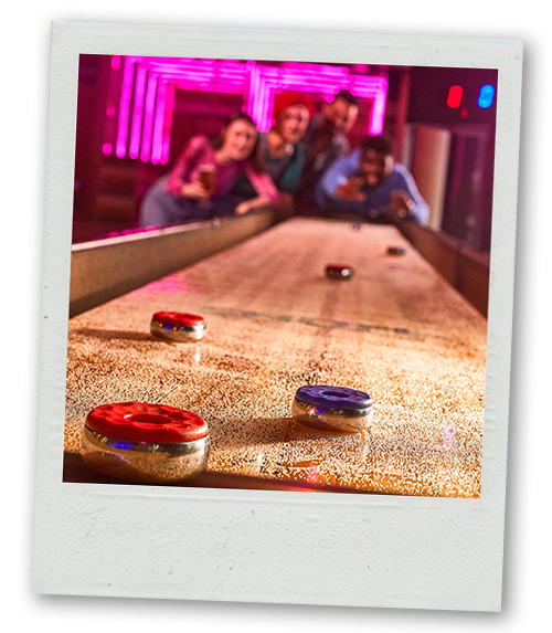 A Polaroid of a shuffleboard at Boom Battle Bar