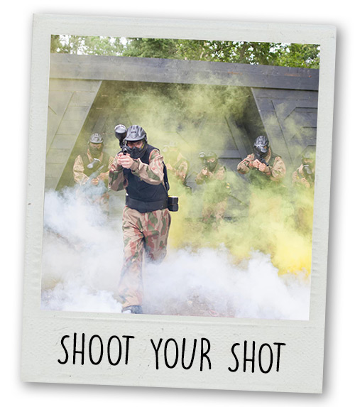 A Polaroid of a group of men emerging from some smoke with paintball guns with the caption Shoot Your Shot