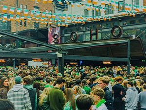 Concert Square packed out with party goers with lots of Ireland flags 