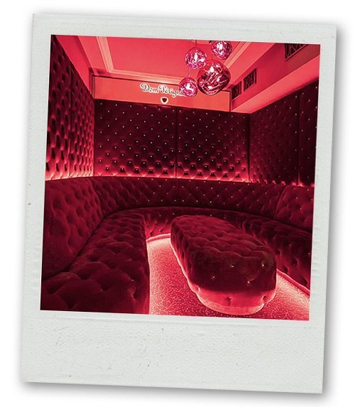 A Polaroid of a booth in a nightclub