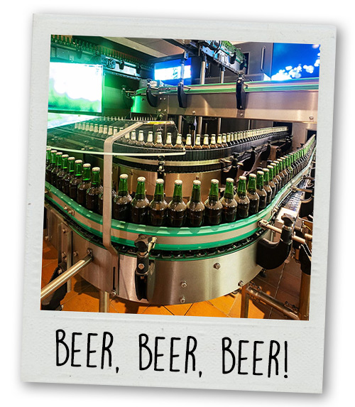 A Polaroid of a load of beers on a conveyor belt with the caption beer beer beer 