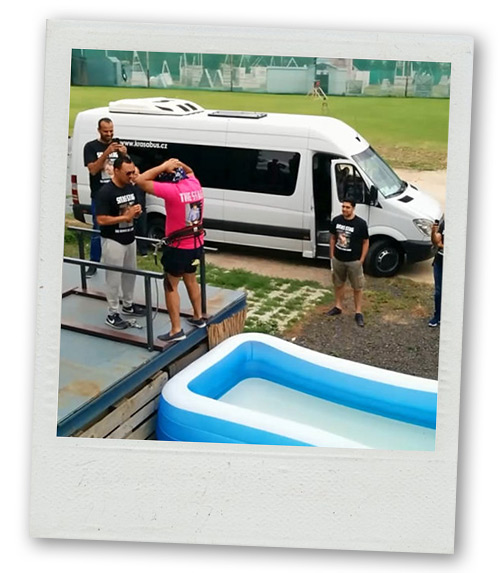 A Polaroid of a man on his stag do about to jump into a pool of cold water thinking it will be a bungee jump