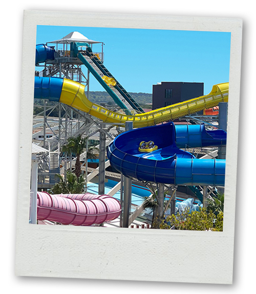 A Polaroid of three waterslides