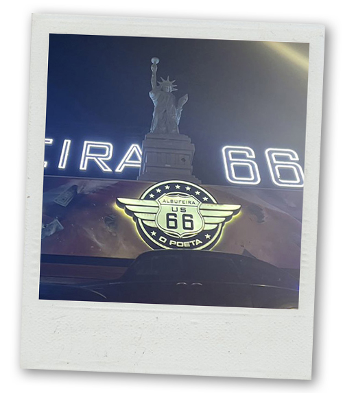A Polaroid of a bar with the statue of liberty outside it