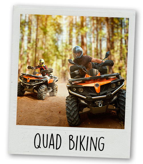 A Polaroid of two people quad biking with the caption Quad Biking