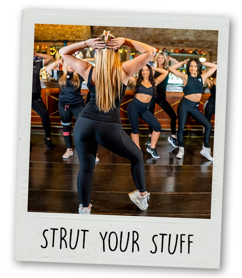 A Polaroid of a female dancer instructor teaching a hen do group how to do a dance class with the caption Strut Your Stuff