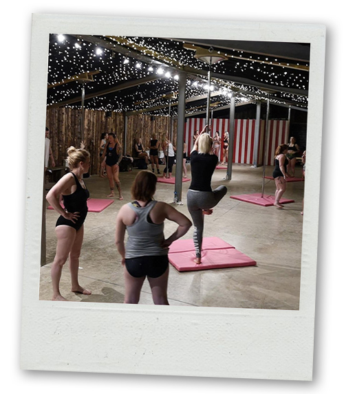 A Polaroid of a hen do group learning pole dance