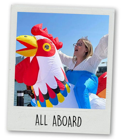 A Polaroid of a woman riding an inflatable chicken with the caption All Aboard