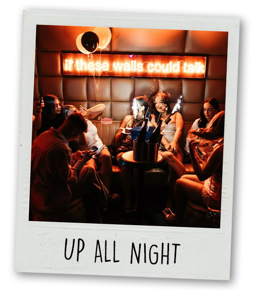 A Polaroid captioned Up All Night of a group of people sat in a booth at Ollie's with a sign on the wall that reads If these walls could talk