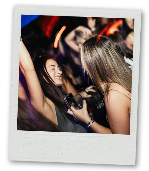 A Polaroid of some party goers dancing at Ollie's